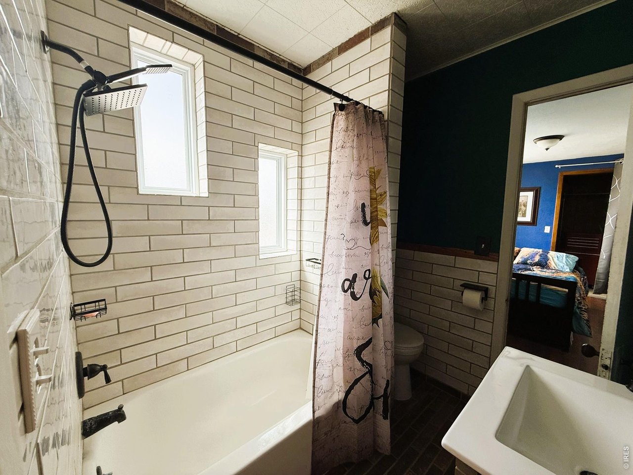 1935 County Road 75 Fleming, CO 80728 - Photo 11 of 31 a bathroom with a sink and a shower