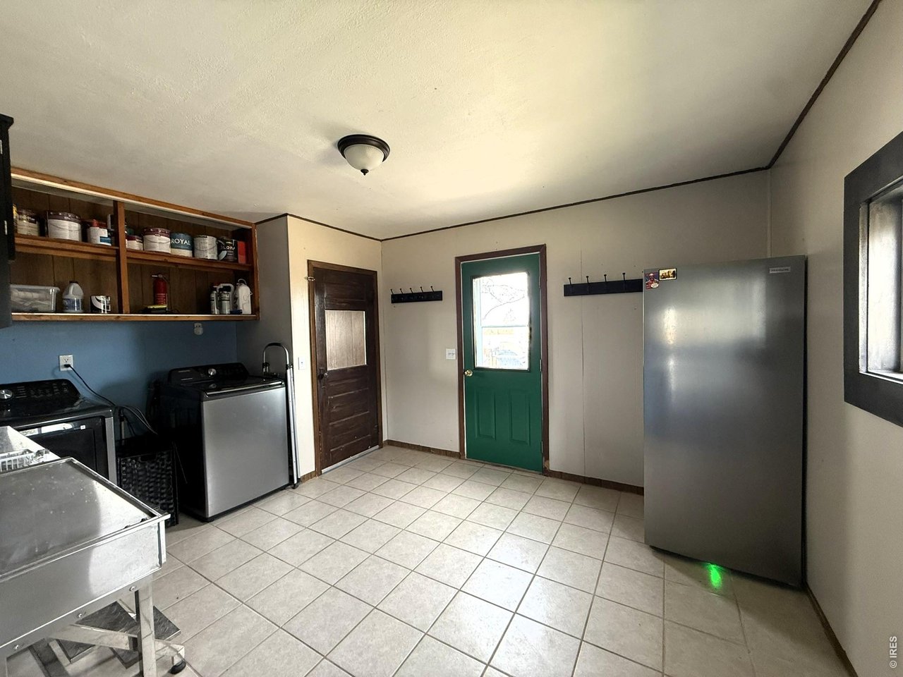 1935 County Road 75 Fleming, CO 80728 - Photo 16 of 31 a view of a kitchen with refrigerator and window