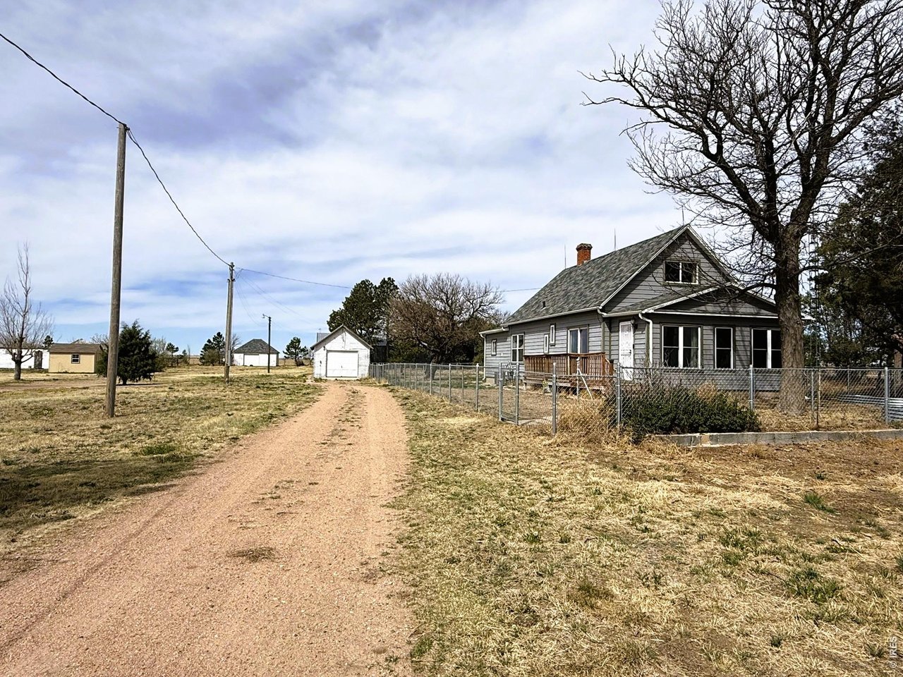 1935 County Road 75 Fleming, CO 80728 - Photo 2 of 31 a front view of a house with a yard
