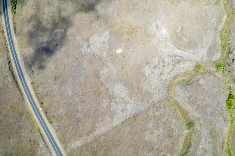 an aerial view of mountain with beach