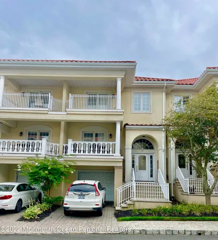 a front view of a building with garden