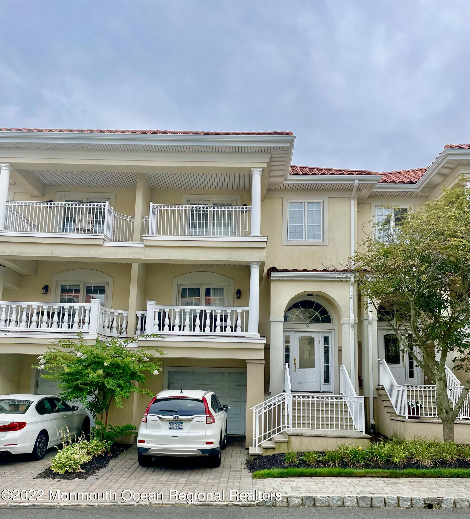 Undisclosed Address Long Branch, NJ 07740 - Photo 2 of 7 a front view of a building with garden