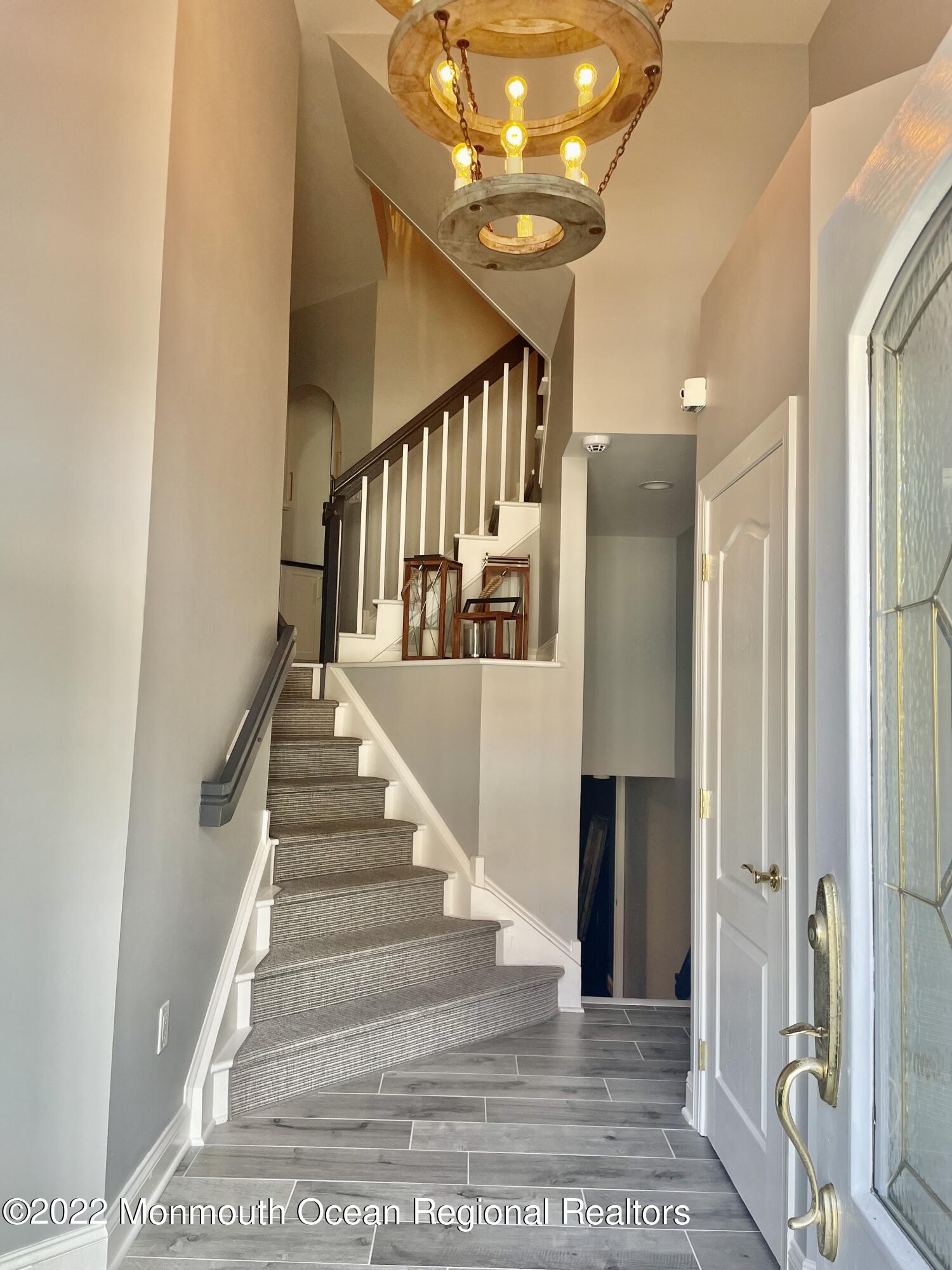 Undisclosed Address Long Branch, NJ 07740 - Photo 3 of 7 a view of entryway and hall with wooden floor