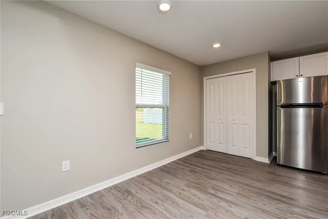 a kitchen with a refrigerator sink and microwave
