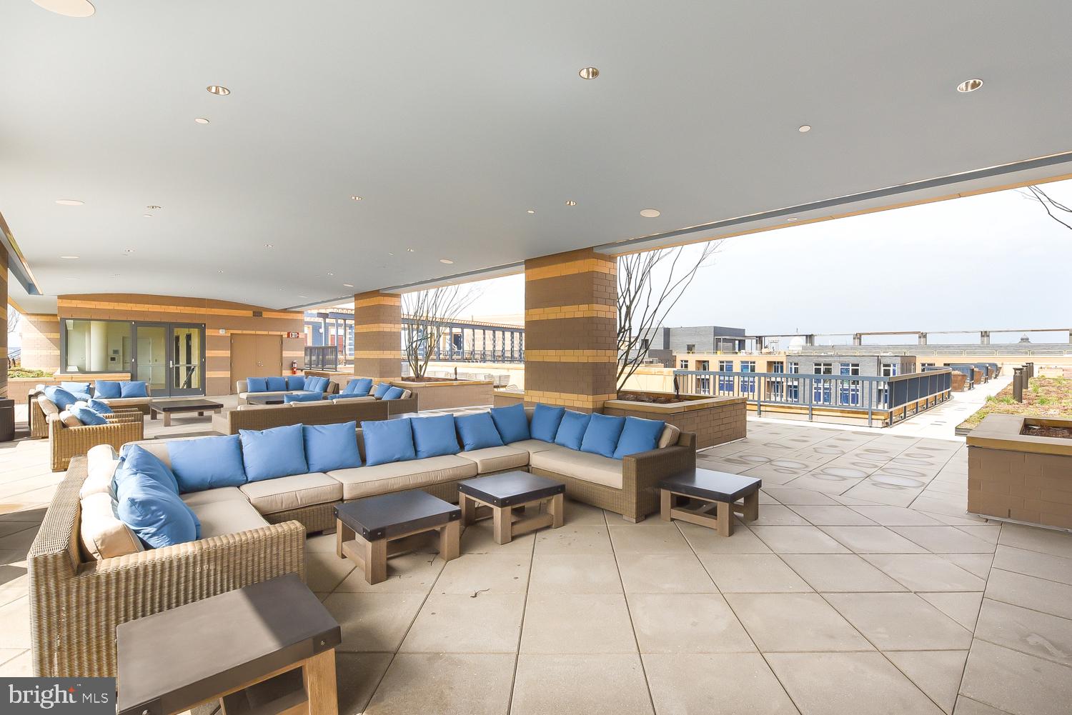880 New Jersey Avenue Southeast, Unit STUDIO Washington, DC 20003 - Photo 18 of 24 a living room with furniture and a table
