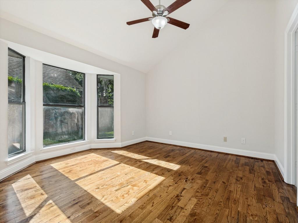 4010 Rive Lane Addison, TX 75001 - Photo 17 of 25 a view of a room with wooden floor and white walls