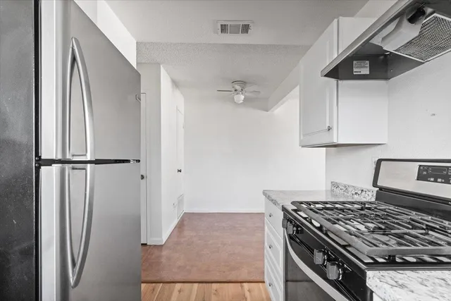 a view of a bathroom from a hallway