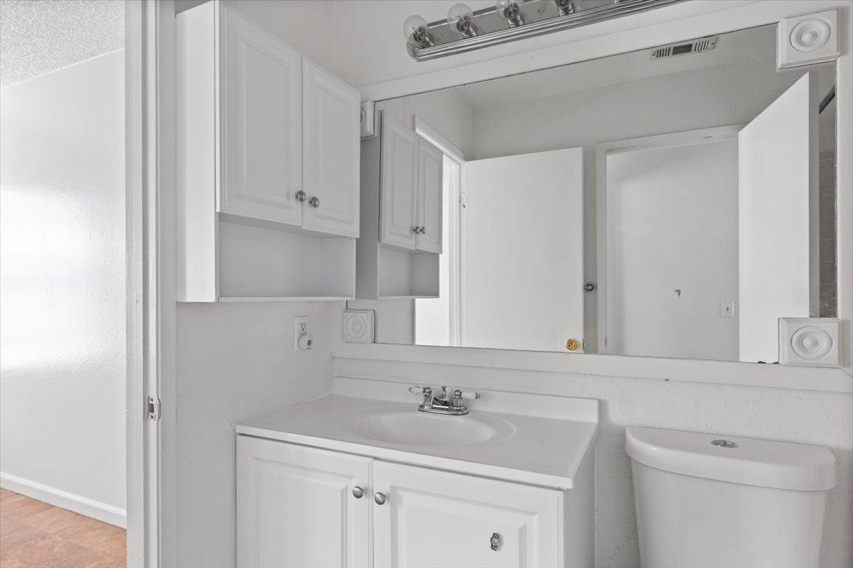 11570 Garnet Way, Unit 4 Auburn, CA 95602 - Photo 14 of 44 a bathroom with a sink and a mirror