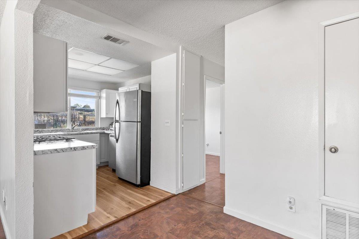 11570 Garnet Way, Unit 4 Auburn, CA 95602 - Photo 9 of 44 a kitchen with refrigerator and cabinets