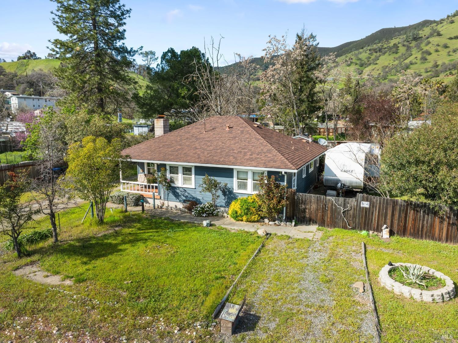 a view of a house with pool and sitting area