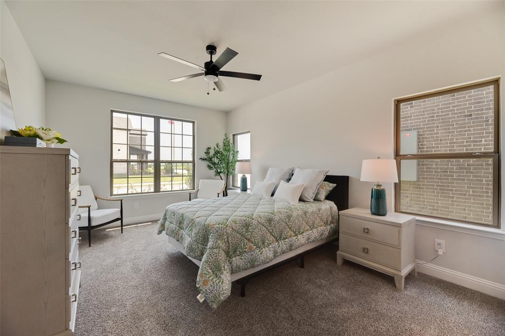 5220 Picasso Road Royse City, TX 75189 - Photo 11 of 28 a bedroom with a bed dresser and a window