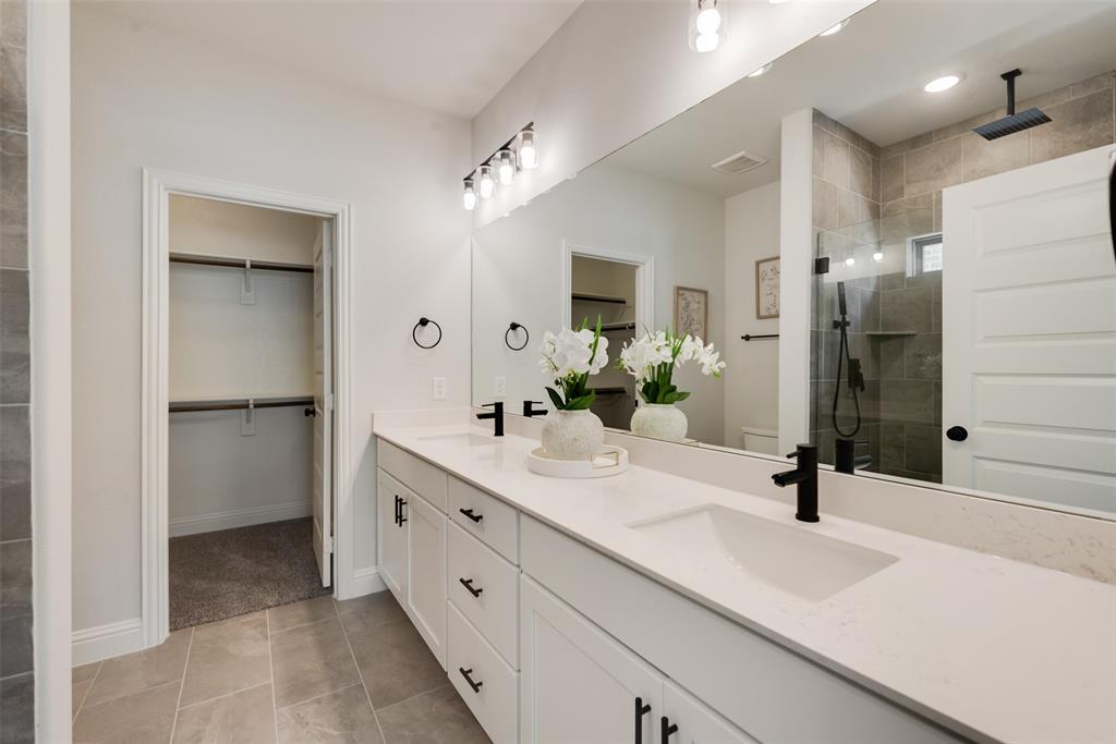 5220 Picasso Road Royse City, TX 75189 - Photo 12 of 28 a bathroom with a double vanity sink mirror and double