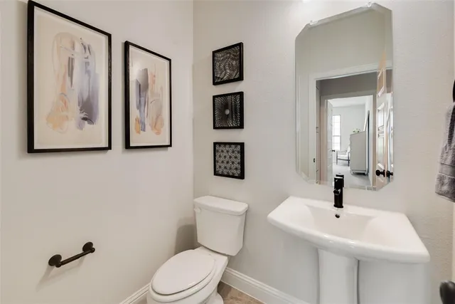 a view of a hallway with living room and dining room