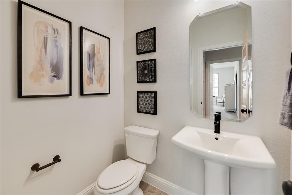 5220 Picasso Road Royse City, TX 75189 - Photo 14 of 28 a bathroom with a toilet sink and mirror