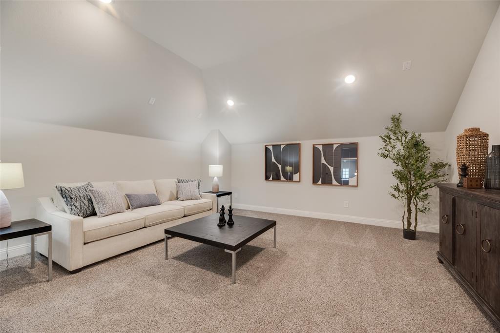 5220 Picasso Road Royse City, TX 75189 - Photo 17 of 28 a living room with furniture and flowers