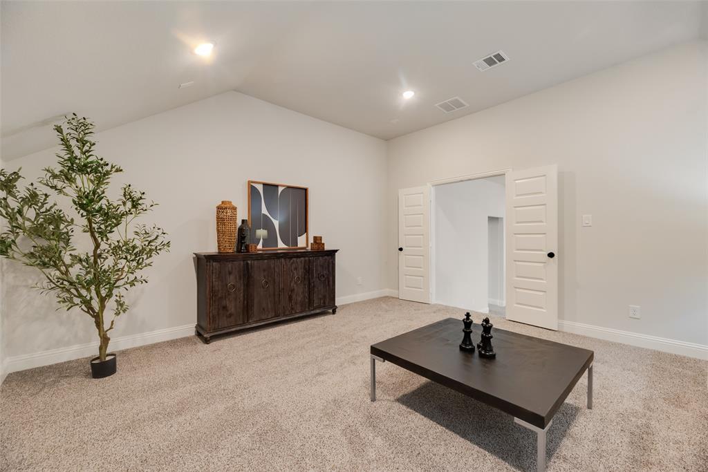 5220 Picasso Road Royse City, TX 75189 - Photo 18 of 28 a living room with furniture and a potted plant