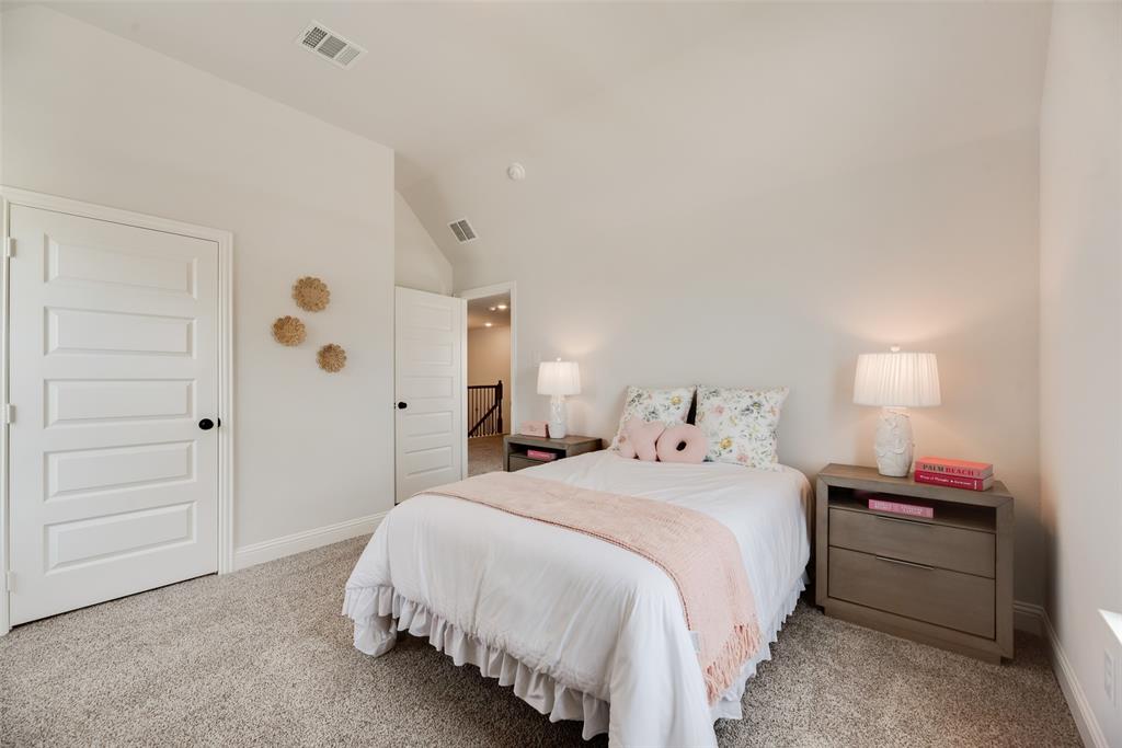 5220 Picasso Road Royse City, TX 75189 - Photo 24 of 28 a bed room with a bed and a night stand