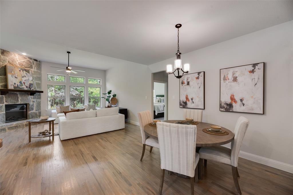 5220 Picasso Road Royse City, TX 75189 - Photo 4 of 28 a living room with furniture and a chandelier