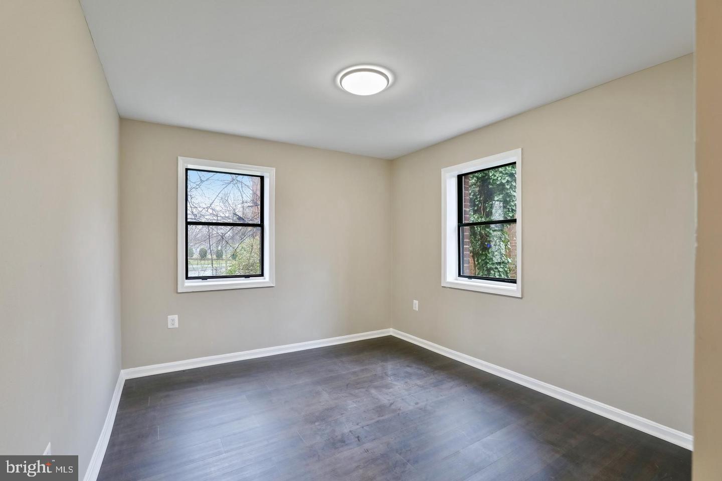 3287 15th Place Southeast, Unit 101 Washington, DC 20020 - Photo 11 of 16 an empty room with windows and closet