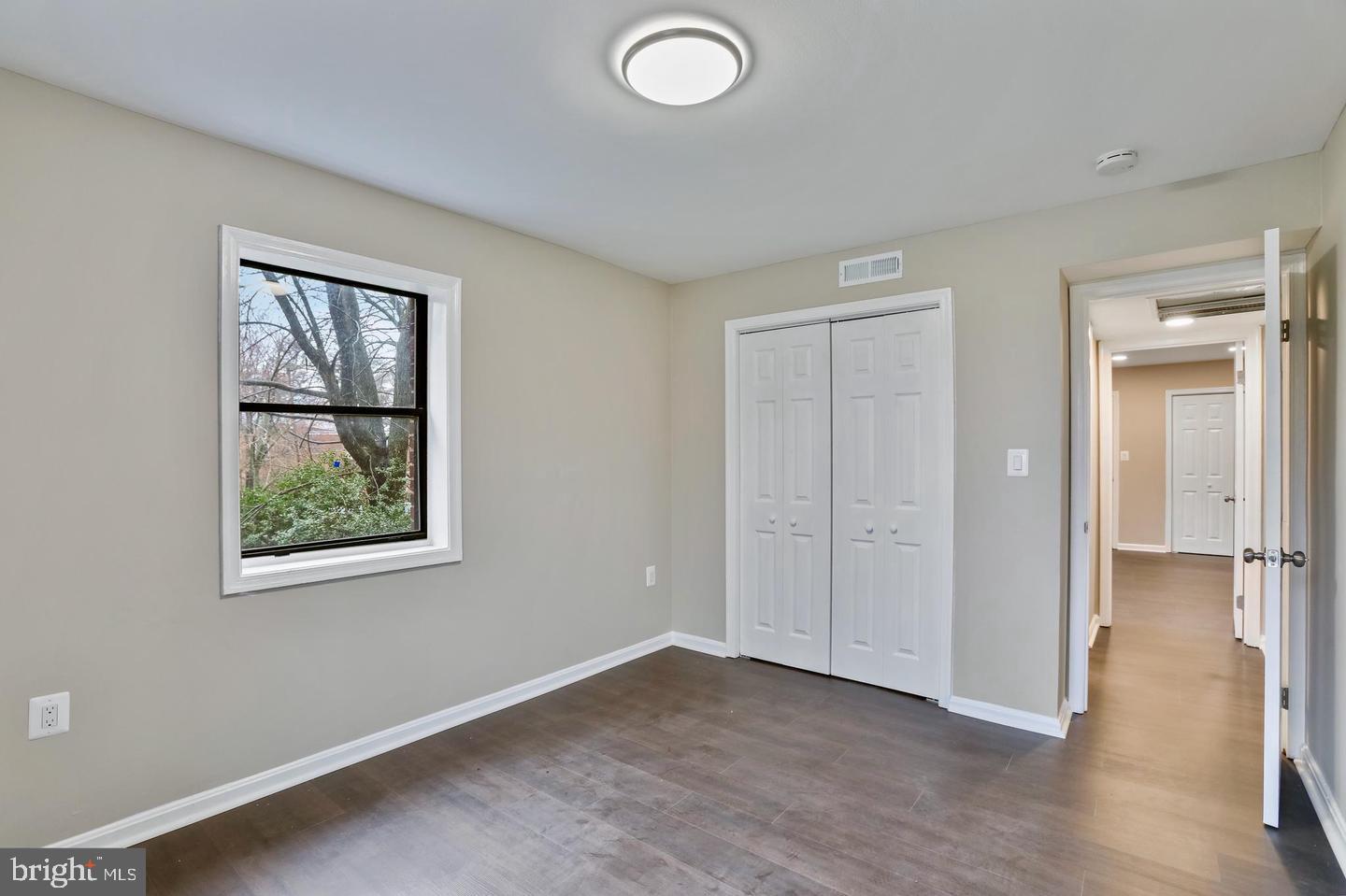 3287 15th Place Southeast, Unit 101 Washington, DC 20020 - Photo 10 of 16 an empty room with windows and closet
