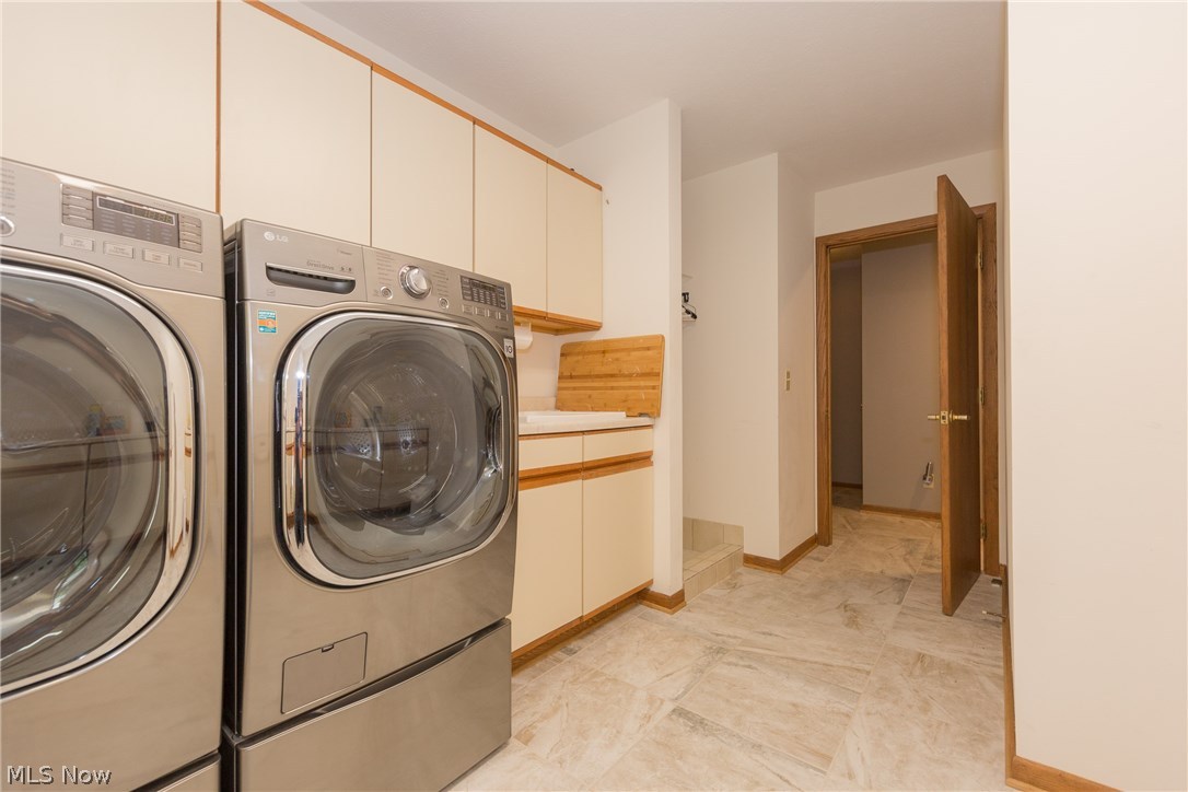 817 Hanover Road Gates Mills, OH 44040 - Photo 17 of 35 The first floor Laundry Room with built-in cabinetry and counter worktops