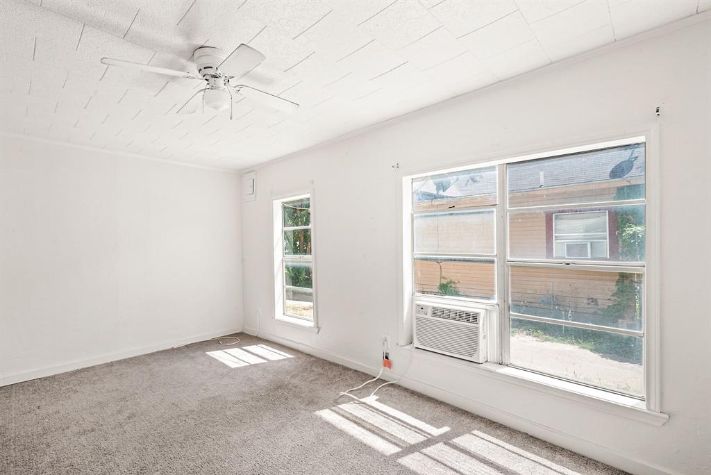 1040 Clinton Avenue Stephenville, TX 76401 - Photo 16 of 26 a view of an empty room with a window