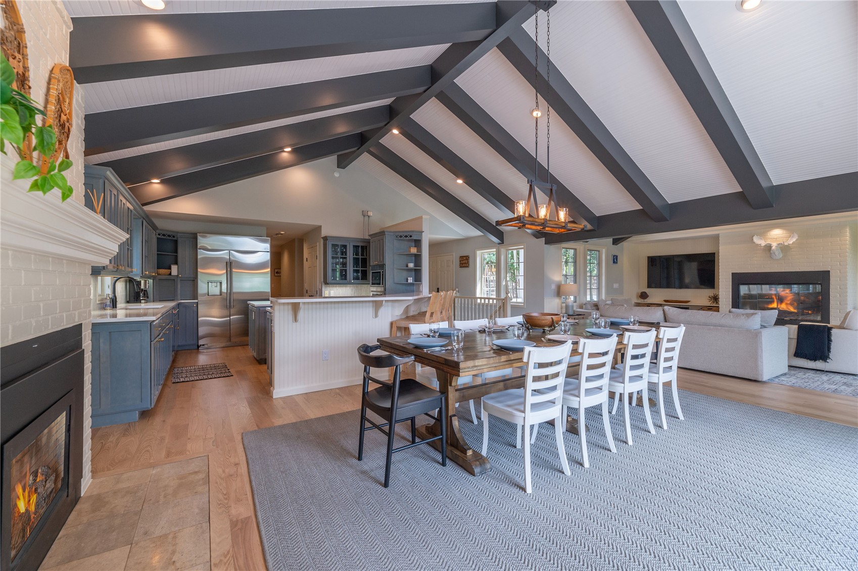 48 Keystone Ranch Golf Service Road Keystone, CO 80435 - Photo 11 of 49 Dining area is central to the great room with a fireplace and plenty of sun from the upper deck area
