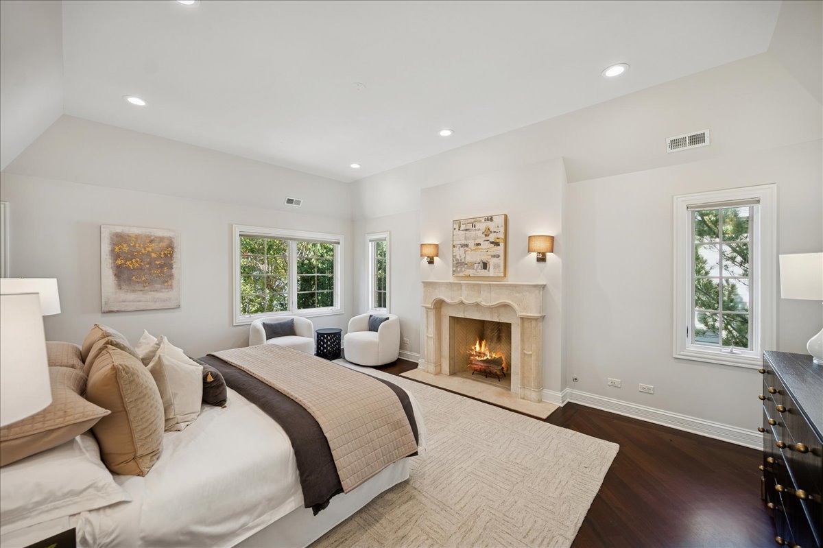 520 Provident Avenue Winnetka, IL 60093 - Photo 21 of 41 a bedroom with bed and a fireplace