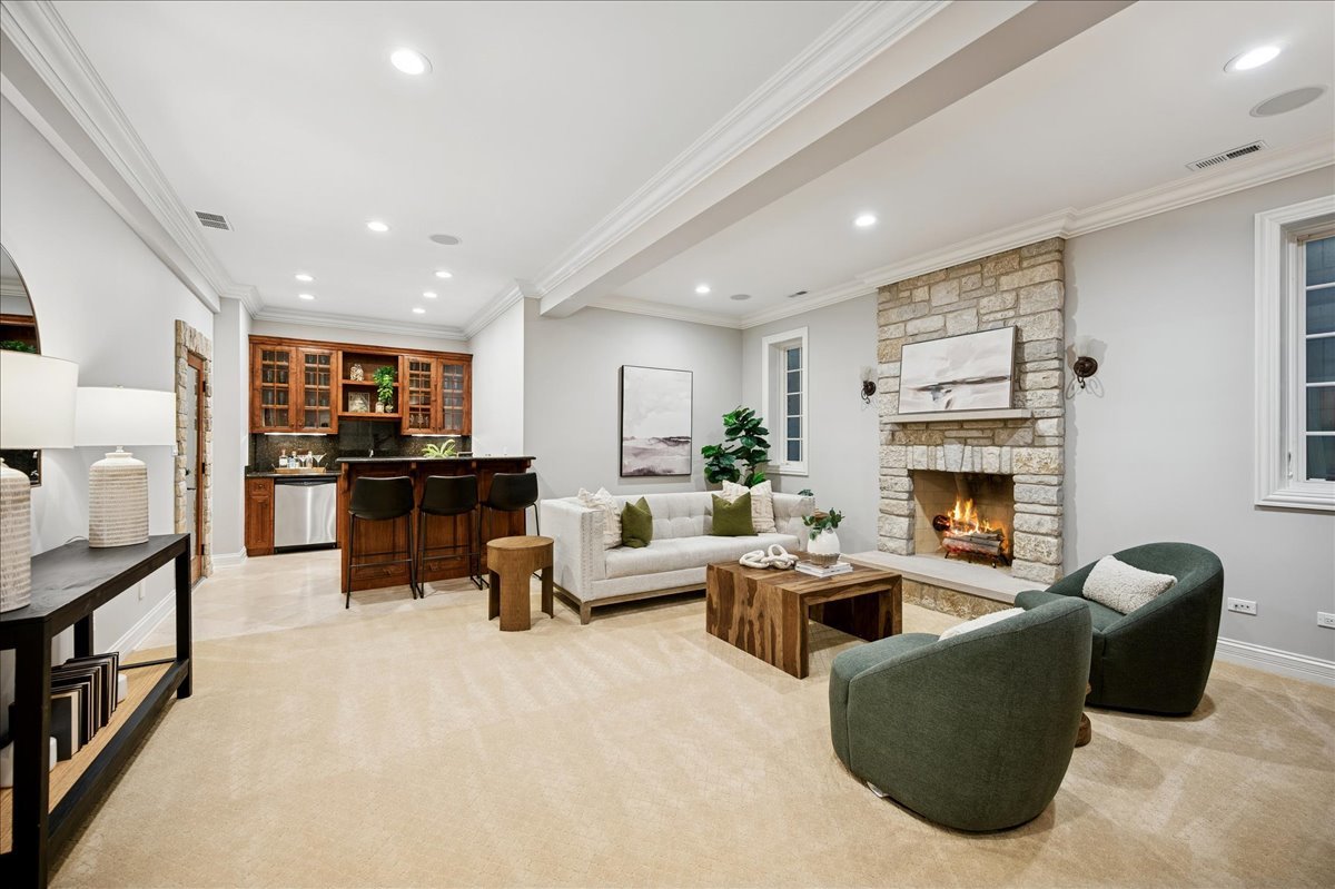 520 Provident Avenue Winnetka, IL 60093 - Photo 28 of 41 a living room with furniture and a fireplace