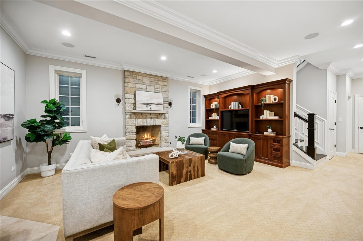 520 Provident Avenue Winnetka, IL 60093 - Photo 29 of 41 a living room with furniture a fireplace and potted plants