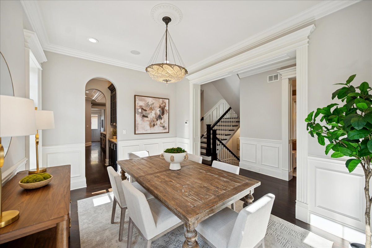 520 Provident Avenue Winnetka, IL 60093 - Photo 6 of 41 a view of a dining room with furniture and a potted plant