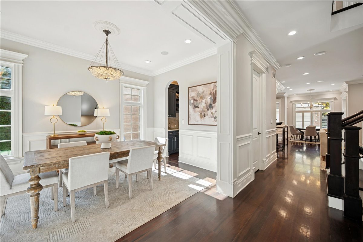 520 Provident Avenue Winnetka, IL 60093 - Photo 7 of 41 a view of a dining room and livingroom with furniture wooden floor a chandelier
