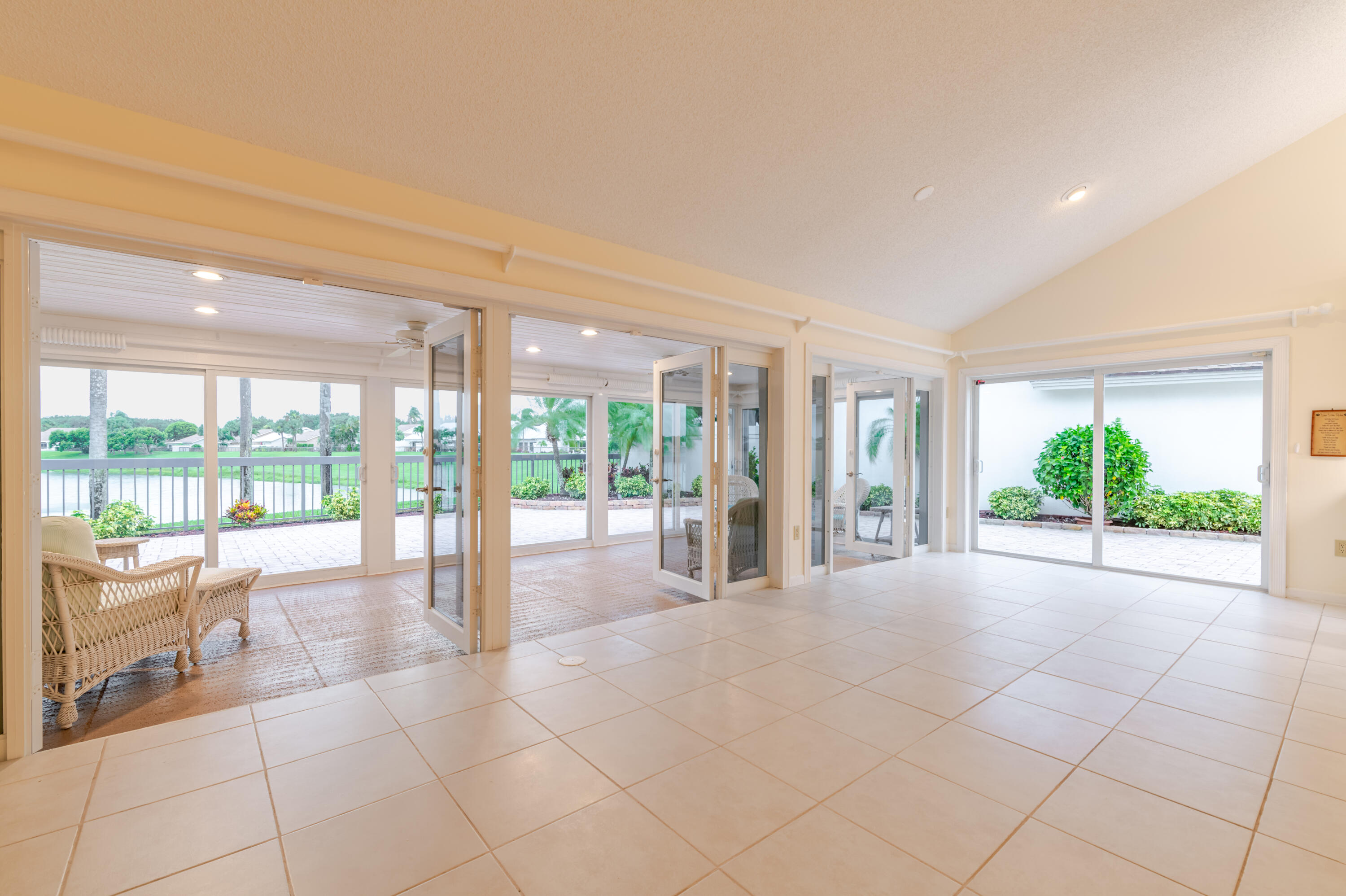 114 Beach Summit Court Jupiter, FL 33477 - Photo 28 of 97 23 Dining and Sunroom - doors open