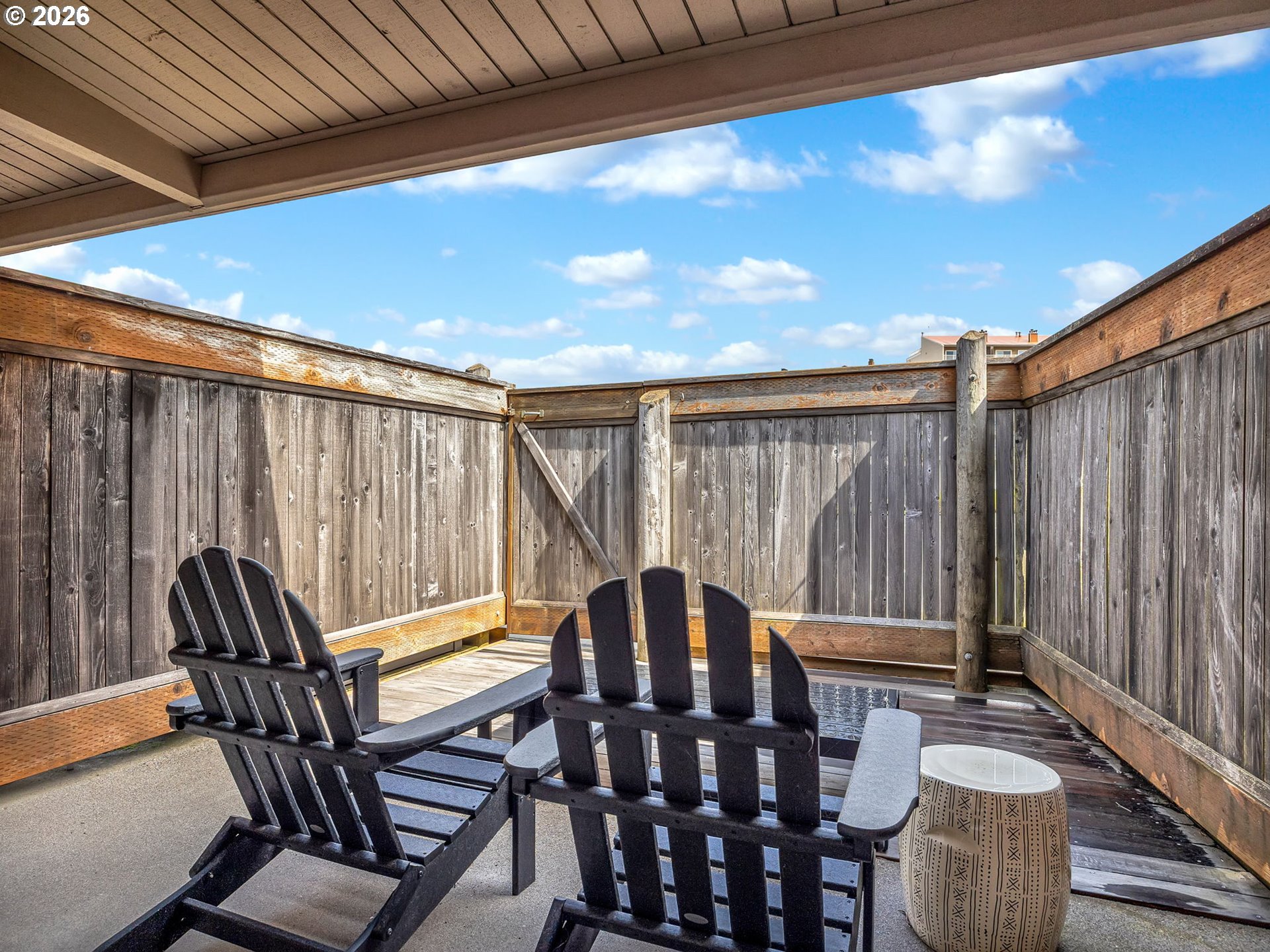 101 13th Street, Unit 211 Gearhart, OR 97138 - Photo 18 of 24 a view of a chairs and table in patio