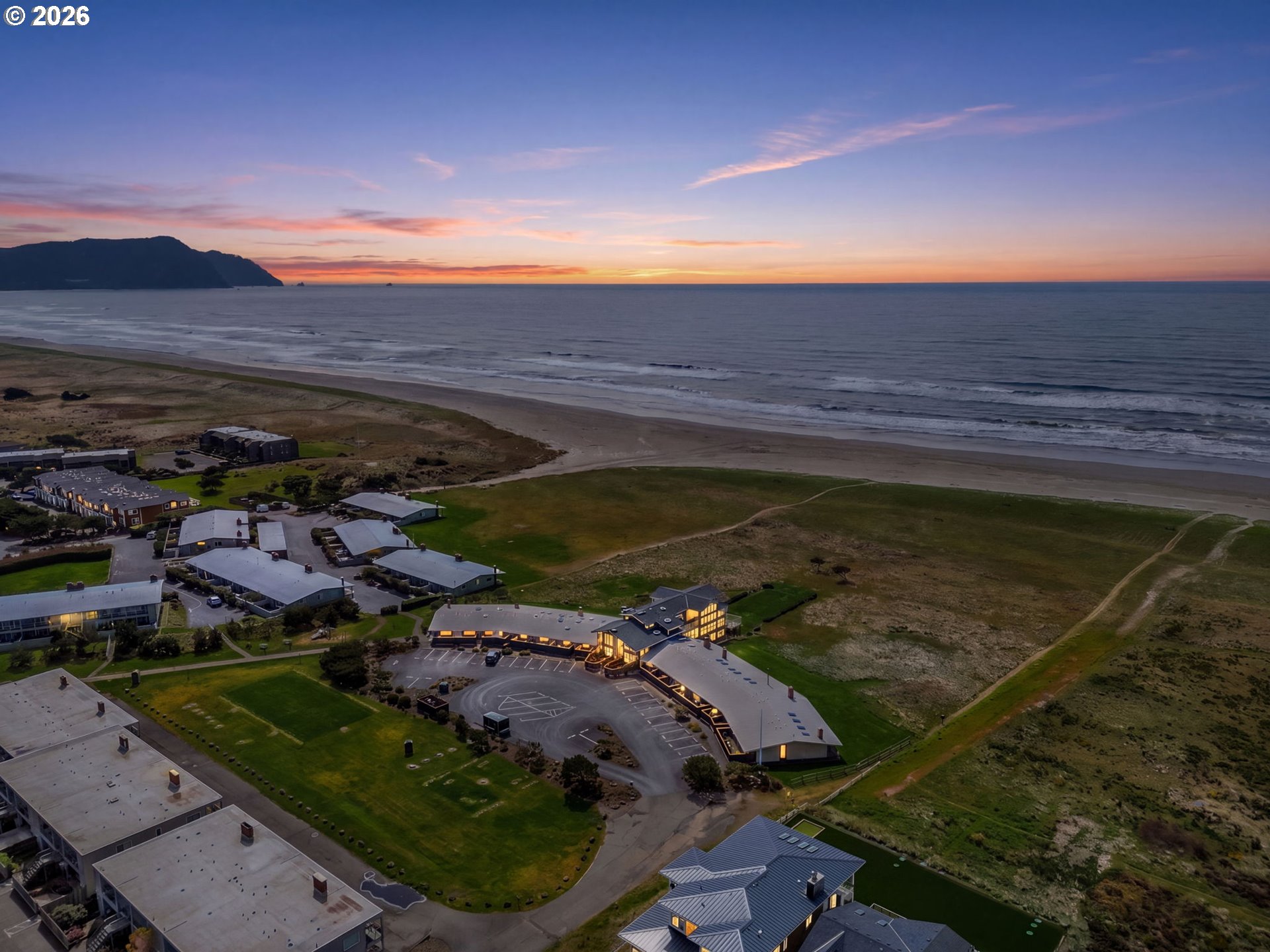 101 13th Street, Unit 211 Gearhart, OR 97138 - Photo 2 of 24 an aerial view of residential houses with outdoor space