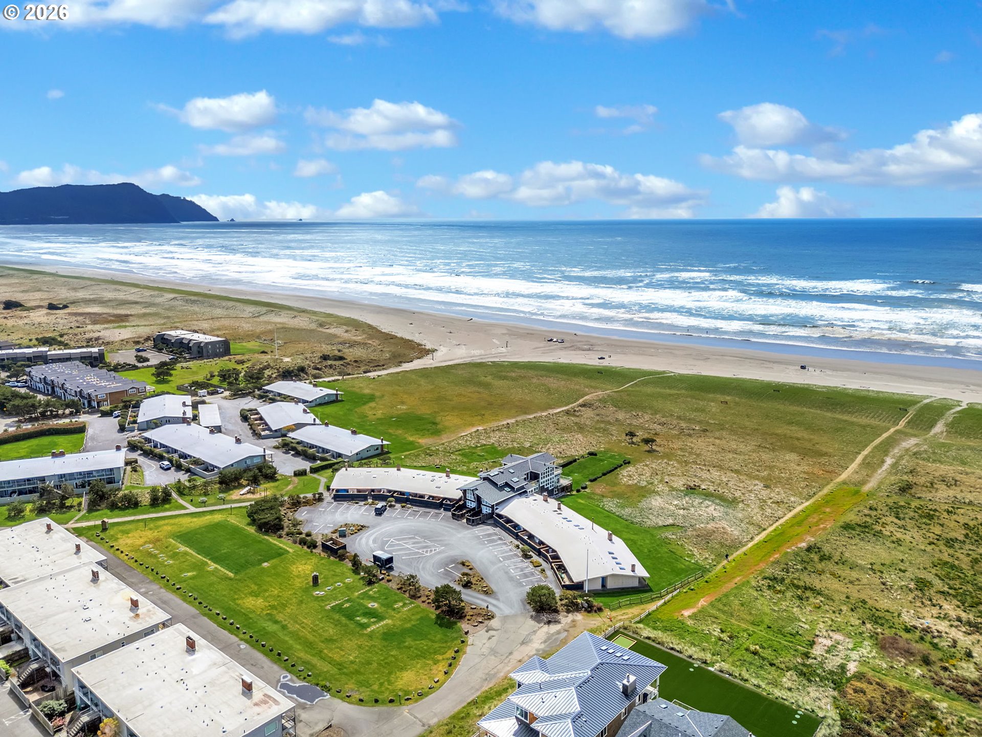 101 13th Street, Unit 211 Gearhart, OR 97138 - Photo 24 of 24 an aerial view of residential houses with outdoor space
