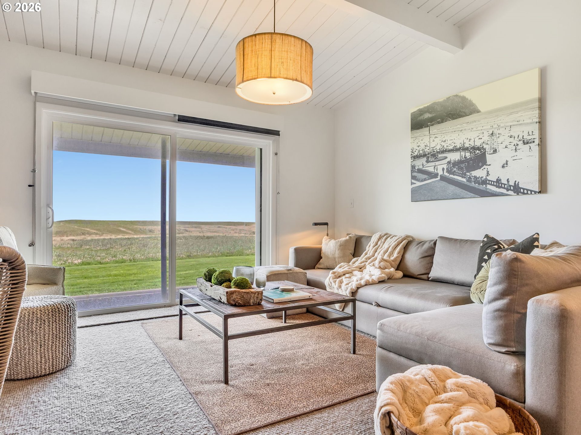 101 13th Street, Unit 211 Gearhart, OR 97138 - Photo 5 of 24 a living room with furniture and a large window