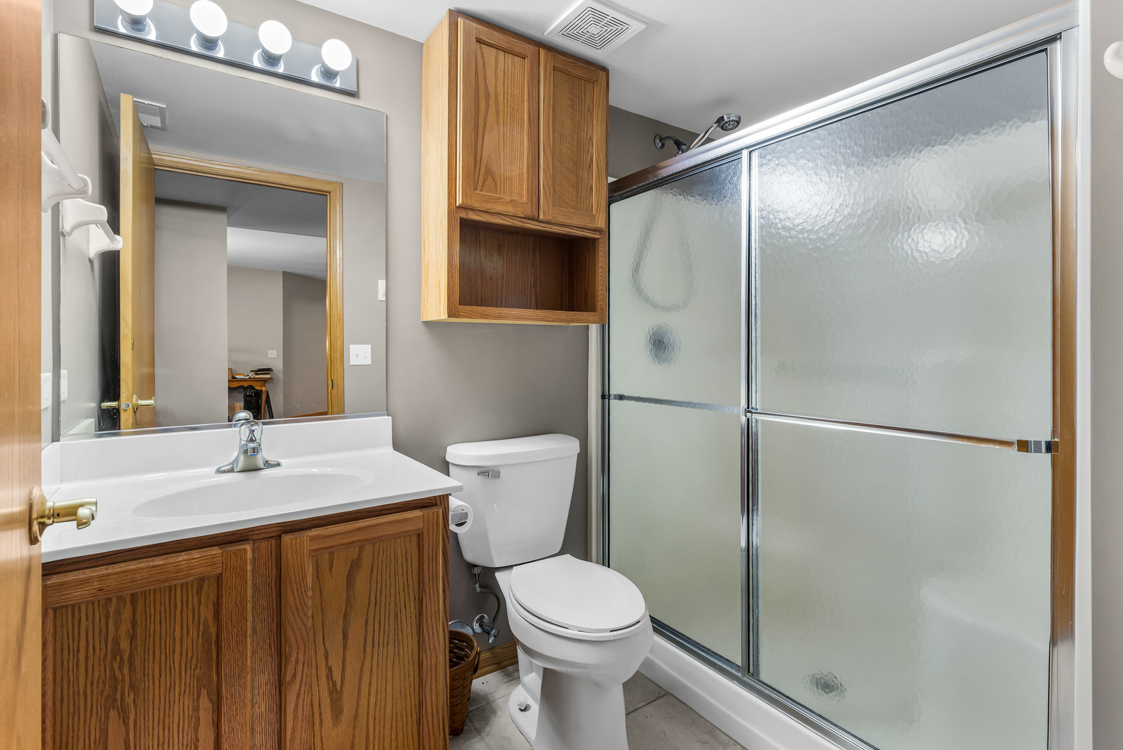 6820 Winding Trail, Unit 101 Oak Forest, IL 60452 - Photo 19 of 21 a bathroom with a sink toilet and shower