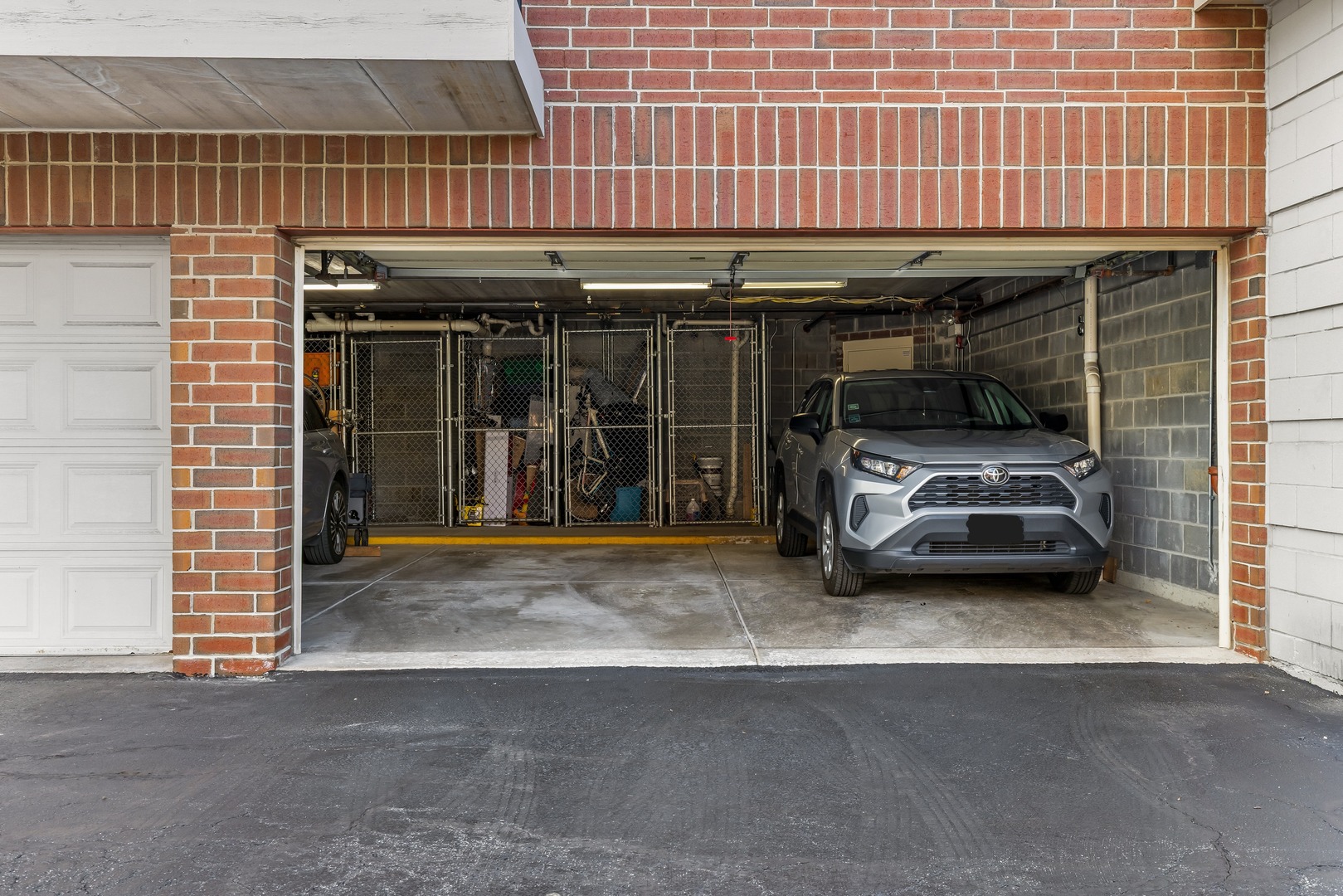 6820 Winding Trail, Unit 101 Oak Forest, IL 60452 - Photo 21 of 21 a view of parking garage with a table and chair