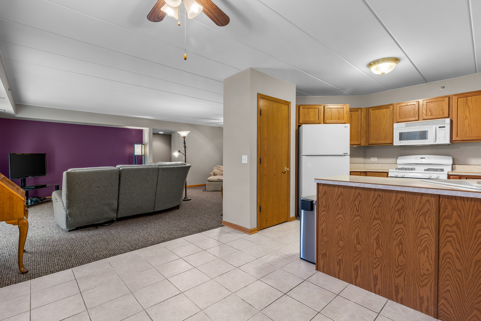 6820 Winding Trail, Unit 101 Oak Forest, IL 60452 - Photo 7 of 21 a living room with furniture and a chandelier