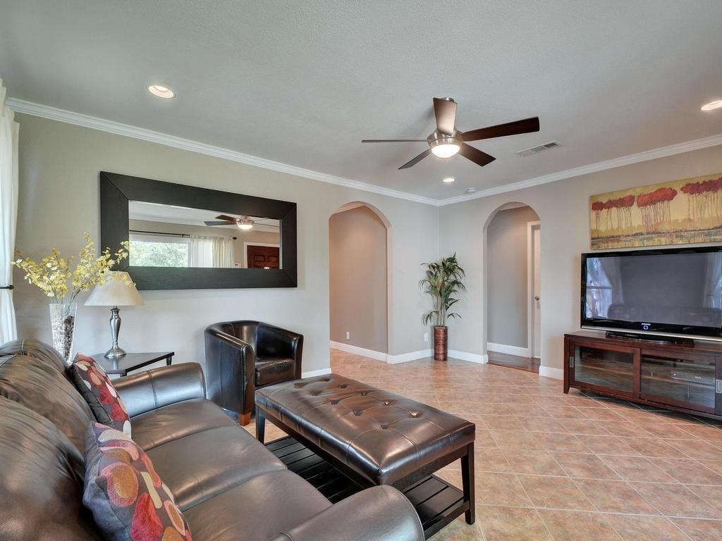 610 West N Loop Boulevard Austin, TX 78751 - Photo 5 of 29 Living area featuring tiled flooring, recessed lighting, and a ceiling fan