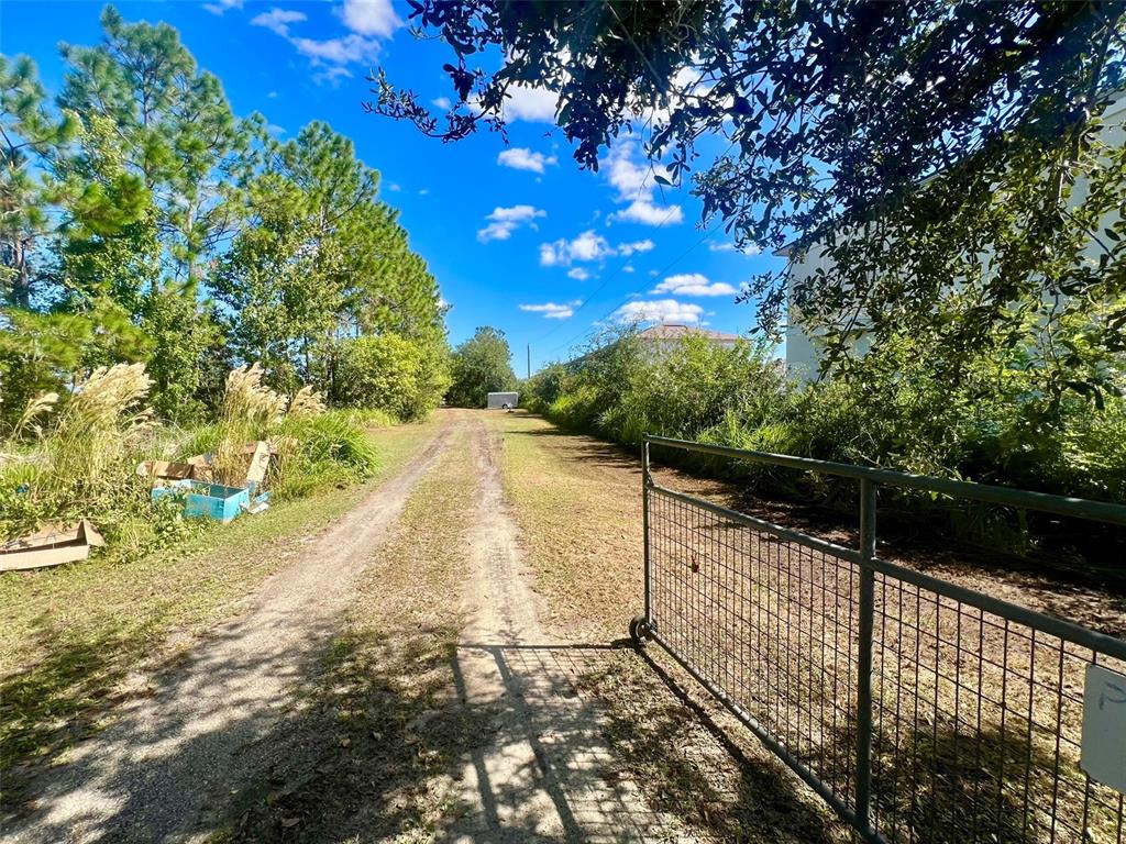 2845 Old Hickory Tree Road St. Cloud, FL 34772 - Photo 10 of 12 a view of an outdoor space and a yard