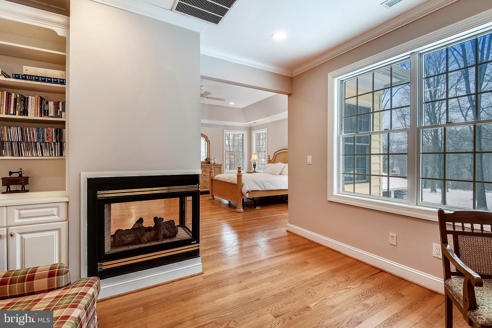 13610 Query Mill Road North Potomac, MD 20878 - Photo 25 of 60 Owners' Suite Sitting Room w/ 2-sided fireplace