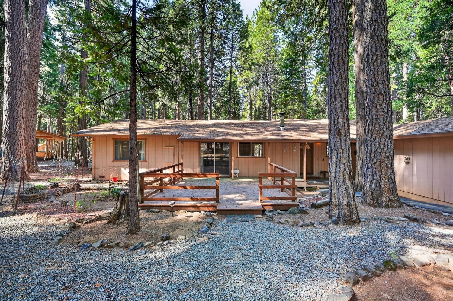 20191 Kit Court Volcano, CA 95689 - Photo 6 of 54 a view of a house with backyard chairs and a fire pit
