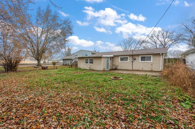 a view of house with yard