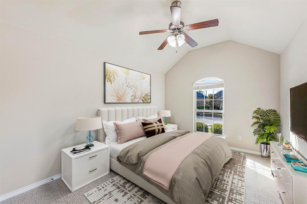 5022 Hidden Creek Road Garland, TX 75043 - Photo 26 of 36 a bedroom with a bed and a chandelier