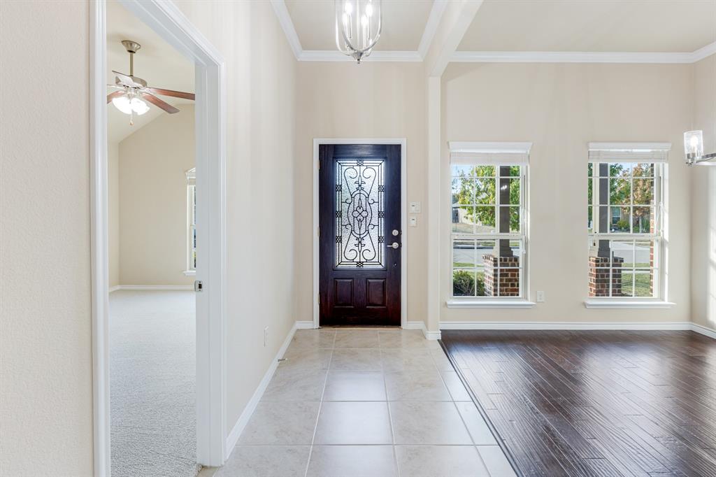 5022 Hidden Creek Road Garland, TX 75043 - Photo 3 of 36 an empty room with wooden floor and windows