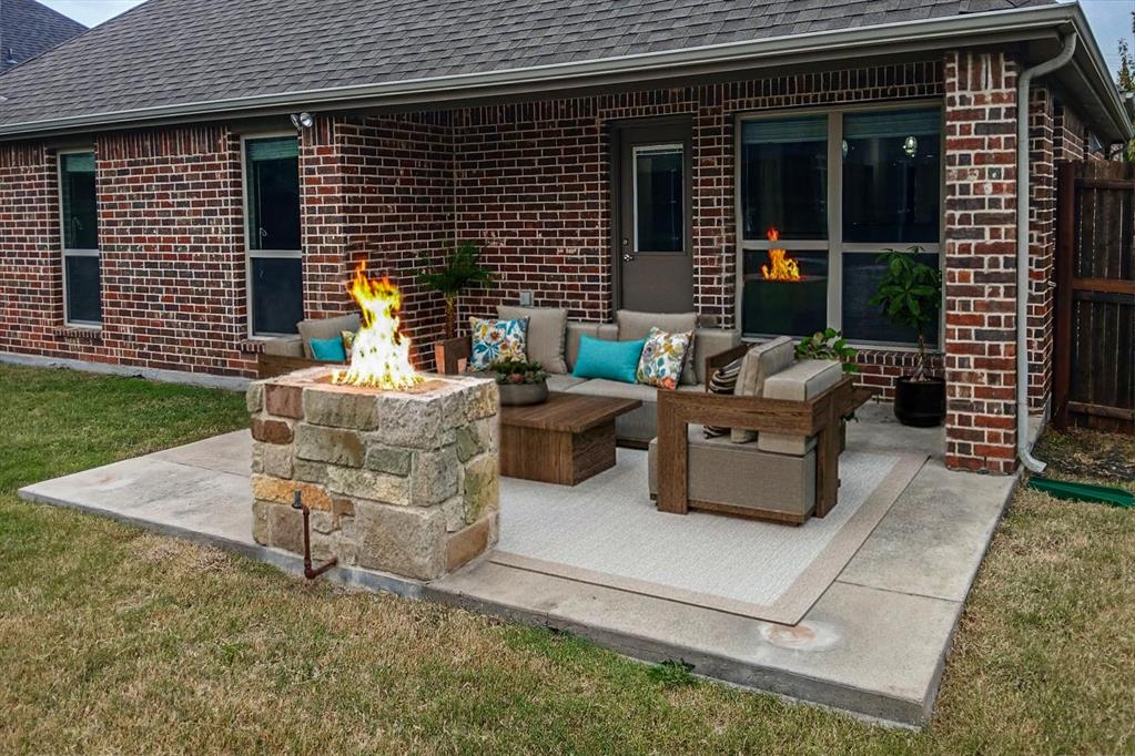 5022 Hidden Creek Road Garland, TX 75043 - Photo 35 of 36 a view of a patio with table and chairs and a barbeque