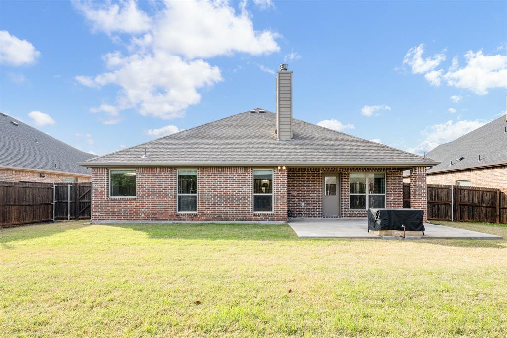 5022 Hidden Creek Road Garland, TX 75043 - Photo 36 of 36 a front view of house with yard and outdoor seating