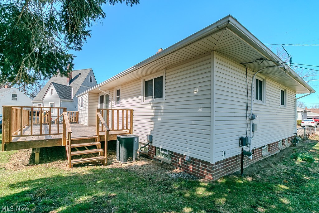 30224 Regent Road Wickliffe, OH 44092 - Photo 27 of 27 Rear view of property featuring a yard and a wooden deck